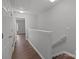 Hallway with hardwood floors and stair access at 3553 Calpella Ct, Charlotte, NC 28262