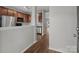 Hallway view into kitchen featuring stainless steel appliances, modern countertops, and wood cabinetry at 3553 Calpella Ct, Charlotte, NC 28262