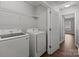 Laundry room with washer, dryer and wire rack shelving at 3553 Calpella Ct, Charlotte, NC 28262