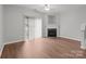 Spacious living room offers a fireplace, ceiling fan, and natural light at 3553 Calpella Ct, Charlotte, NC 28262