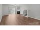 Bright living room boasts a fireplace, ceiling fan, and access to an outdoor space at 3553 Calpella Ct, Charlotte, NC 28262
