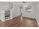 Bright open-concept living room with access to stairs and kitchen at 3553 Calpella Ct, Charlotte, NC 28262