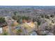 House and lot nestled among mature trees in a lush forest in the aerial view of a neighborhood at 3722 Thompson St, Newton, NC 28658
