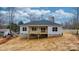 View of a new construction home, displaying the backyard and wooden deck at 3722 Thompson St, Newton, NC 28658