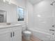 Bright bathroom featuring tub shower combination, white vanity, and neutral flooring at 3722 Thompson St, Newton, NC 28658