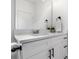 Sleek bathroom with a quartz countertop, modern fixtures, and white cabinets at 3722 Thompson St, Newton, NC 28658