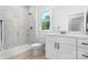 Modern bathroom with white marble shower, contemporary vanity, and bright natural light at 3722 Thompson St, Newton, NC 28658