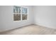 Neutral bedroom with a large window and modern flooring offers a peaceful retreat at 3722 Thompson St, Newton, NC 28658