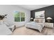 Bright main bedroom showcasing a large window with natural light, stylish decor, and a serene atmosphere at 3722 Thompson St, Newton, NC 28658