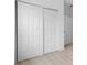A bright bedroom features white closet doors with paneled detailing and light hardwood floors at 3722 Thompson St, Newton, NC 28658