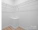 Walk-in closet with wire shelving and neutral paint, ready for personalization at 3722 Thompson St, Newton, NC 28658
