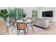 Chic dining area featuring modern chairs, a round table, and seamless flow to the living space and outdoor deck at 3722 Thompson St, Newton, NC 28658