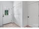 Bright entryway featuring a stylish front door, closet, and new flooring at 3722 Thompson St, Newton, NC 28658