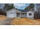 Newly built home with light gray siding, garage, and covered front porch at 3722 Thompson St, Newton, NC 28658