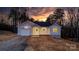 Charming single-story home featuring attached garage and covered porch, set against a colorful sunset backdrop at 3722 Thompson St, Newton, NC 28658
