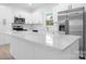 Modern kitchen with stainless steel appliances, white cabinets, and a kitchen island at 3722 Thompson St, Newton, NC 28658