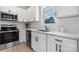 Modern kitchen design features stainless steel appliances, bright countertops, and contemporary white cabinets at 3722 Thompson St, Newton, NC 28658