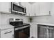 Bright kitchen featuring stainless steel appliances, quartz countertops, and modern cabinetry at 3722 Thompson St, Newton, NC 28658