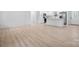 Bright, open-concept living area with contemporary flooring, white trim, and minimalist design at 3722 Thompson St, Newton, NC 28658
