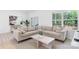 Comfortable living room with a large sectional sofa, decorative rug, and sliding glass doors to the outside at 3722 Thompson St, Newton, NC 28658