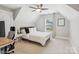 Bedroom with a large window, desk, and a ceiling fan in a modern home at 4228 Legacy Dr, Denver, NC 28037