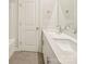 A modern bathroom features a double vanity and tile floor at 4919 Trigney Ct, Charlotte, NC 28214