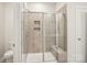 Bathroom shower with tile surround, shower bench and glass doors at 4919 Trigney Ct, Charlotte, NC 28214
