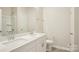 Large vanity with double sinks and tile floor fill this bathroom at 4919 Trigney Ct, Charlotte, NC 28214