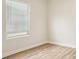 Bright bedroom with wood flooring features a large window at 4919 Trigney Ct, Charlotte, NC 28214