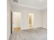 Spacious bedroom with neutral carpeting, tray ceiling and a view to the en-suite bath and closet at 4919 Trigney Ct, Charlotte, NC 28214
