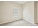 Well-lit bedroom features new carpet, neutral walls, and a window at 4919 Trigney Ct, Charlotte, NC 28214