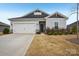 Charming single-story home featuring a two-car garage and well-maintained landscaping at 4919 Trigney Ct, Charlotte, NC 28214