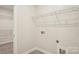 Convenient laundry room with shelving and washer-dryer hookups at 4919 Trigney Ct, Charlotte, NC 28214