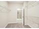 Ample walk-in closet with shelving and easy access to the bathroom at 4919 Trigney Ct, Charlotte, NC 28214