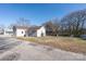 Expansive backyard featuring a large shed, mature trees, and ample space at 528 6Th St, Chester, SC 29706