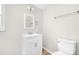 Well-lit bathroom featuring a modern vanity, mirror, and toilet at 528 6Th St, Chester, SC 29706
