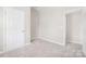 Neutral bedroom features carpet flooring, and access to another room at 528 6Th St, Chester, SC 29706