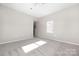 A spacious bedroom featuring neutral carpet and paint with abundant natural light from a window at 528 6Th St, Chester, SC 29706