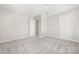 Spacious bedroom with neutral walls and plush carpet, featuring entry doors and ceiling fan at 528 6Th St, Chester, SC 29706