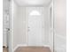 Bright entryway features a white front door, neutral walls, and wood-look flooring at 528 6Th St, Chester, SC 29706