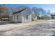Cozy home showcasing a charming front porch with a fresh coat of light-gray paint at 528 6Th St, Chester, SC 29706