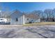 Back of home featuring light grey paint, an asphalt roof, and an air conditioning unit at 528 6Th St, Chester, SC 29706