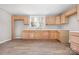 Bright kitchen features new wooden cabinets, a new countertop, and a double window for natural light at 528 6Th St, Chester, SC 29706