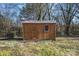 This shed features wood siding, double doors, and a window at 528 6Th St, Chester, SC 29706