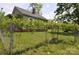 Exterior view of a home's backyard with a chainlink fence and green grass at 529 Gage St, Chester, SC 29706