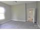 Neutral carpeted bedroom with natural light and entry to hallway at 529 Gage St, Chester, SC 29706