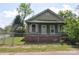 Eye-level view of a charming, fenced in two-story home with a covered porch at 529 Gage St, Chester, SC 29706