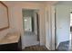Hallway featuring vinyl floors, a sink with marble countertop, and entry to bedroom at 529 Gage St, Chester, SC 29706