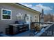 Well-equipped deck with built-in grill, dining area, and stylish decor perfect for outdoor entertaining at 5324 Stonewood Dr, Hickory, NC 28602