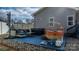 Relaxing backyard patio featuring wicker furniture, hot tub, and stylish accents perfect for outdoor living at 5324 Stonewood Dr, Hickory, NC 28602